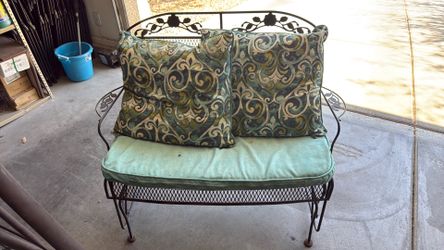 Metal swaying bench with cushions - $40