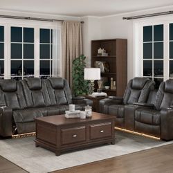 brand new gray bonded leather sofa + loveseat features dual reclining ends with power headrests, storage arm, cupholders