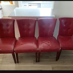 4 red leather chairs