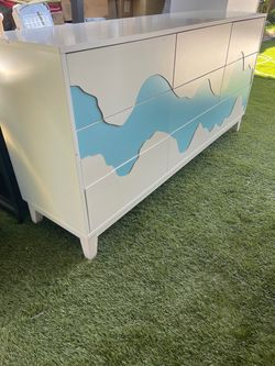 White Dresser with Blue Wave Design