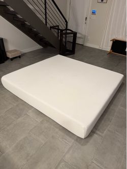 Tuft and needle mattress and mattress topper