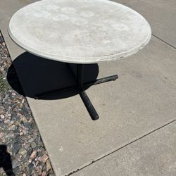 White table (solid) - has been used outdoors