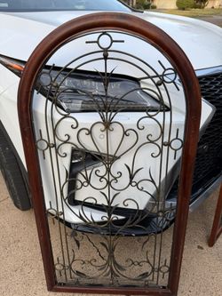 DECORATIVE WALL ART. 26"w x 31 1/4"high; curved at top,  cross streets are Arapaho & Waterview 