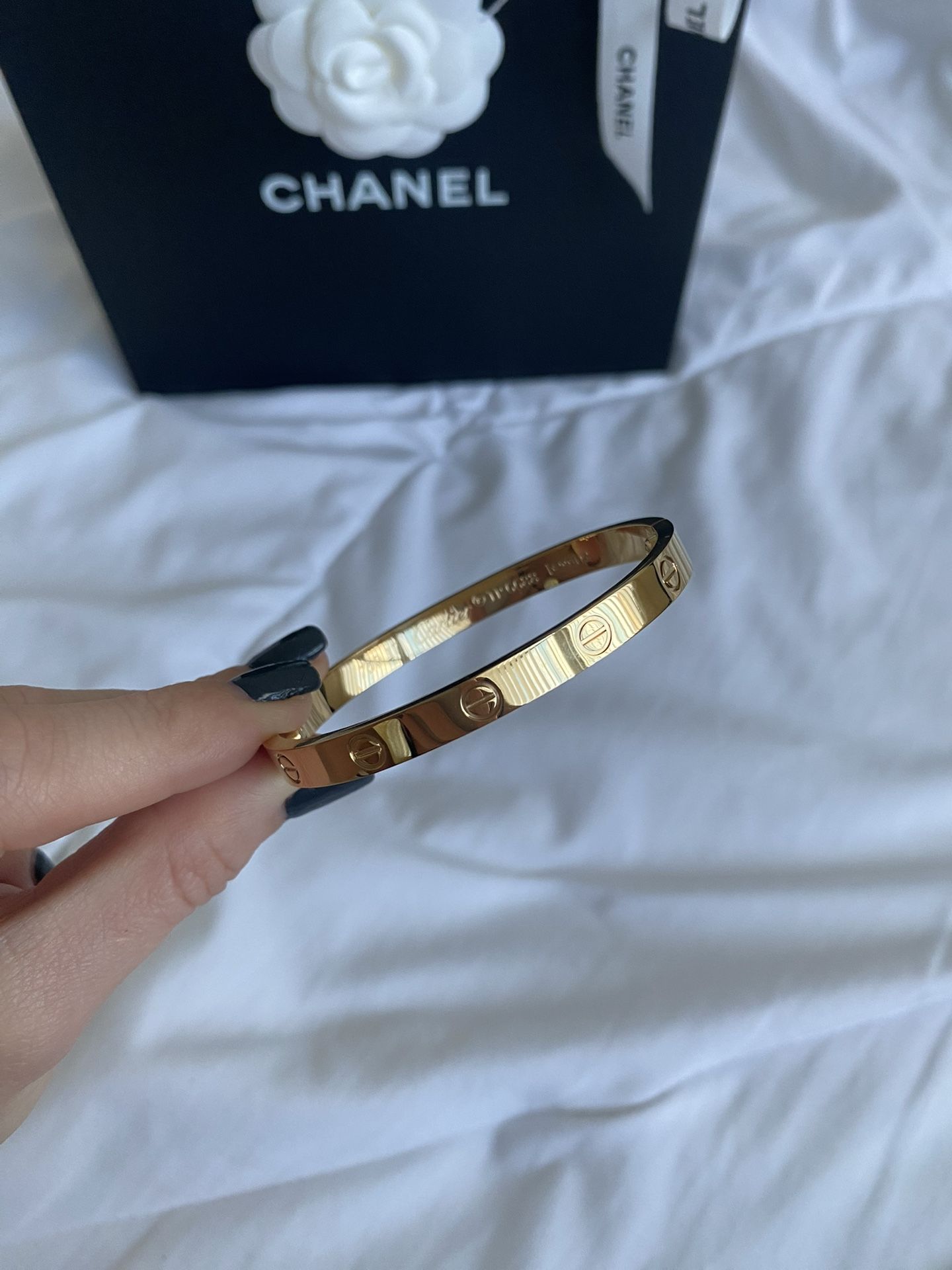 Cartier love bracelet w/ yellow gold, size 18.
