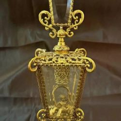 Ornate French gilt bronze and glass perfume bottle with figural scene.