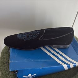 Black suede loafers with blue skull accent. Size 10.5