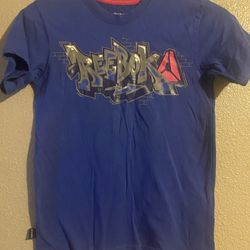 T- Shirt Reebok 4/7 $7  Available In Desoto 👈