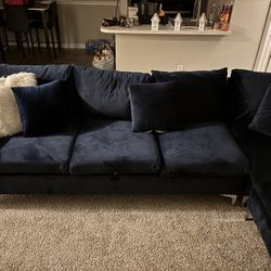 A blue section couch