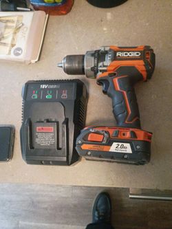 RIDGID GEN5X 18V Lithium-Ion Cordless Brushless Hammer Drill with a 2.0Ah battery and charger