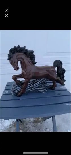 Horse Jumping Over Log Statue