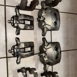 Infiniti Q50 factory brake calipers and brake pads.