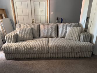 Large Cream Ribbed Fabric Sofa with Pillows