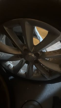 Four almost knew tires and rims 18s
