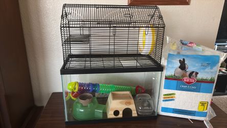 Hamster cage with bedding and accessories