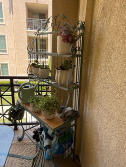 Wrought iron table w/ chairs & hutch