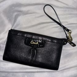 Black Coach Wristlet with gold hardware tassel 
