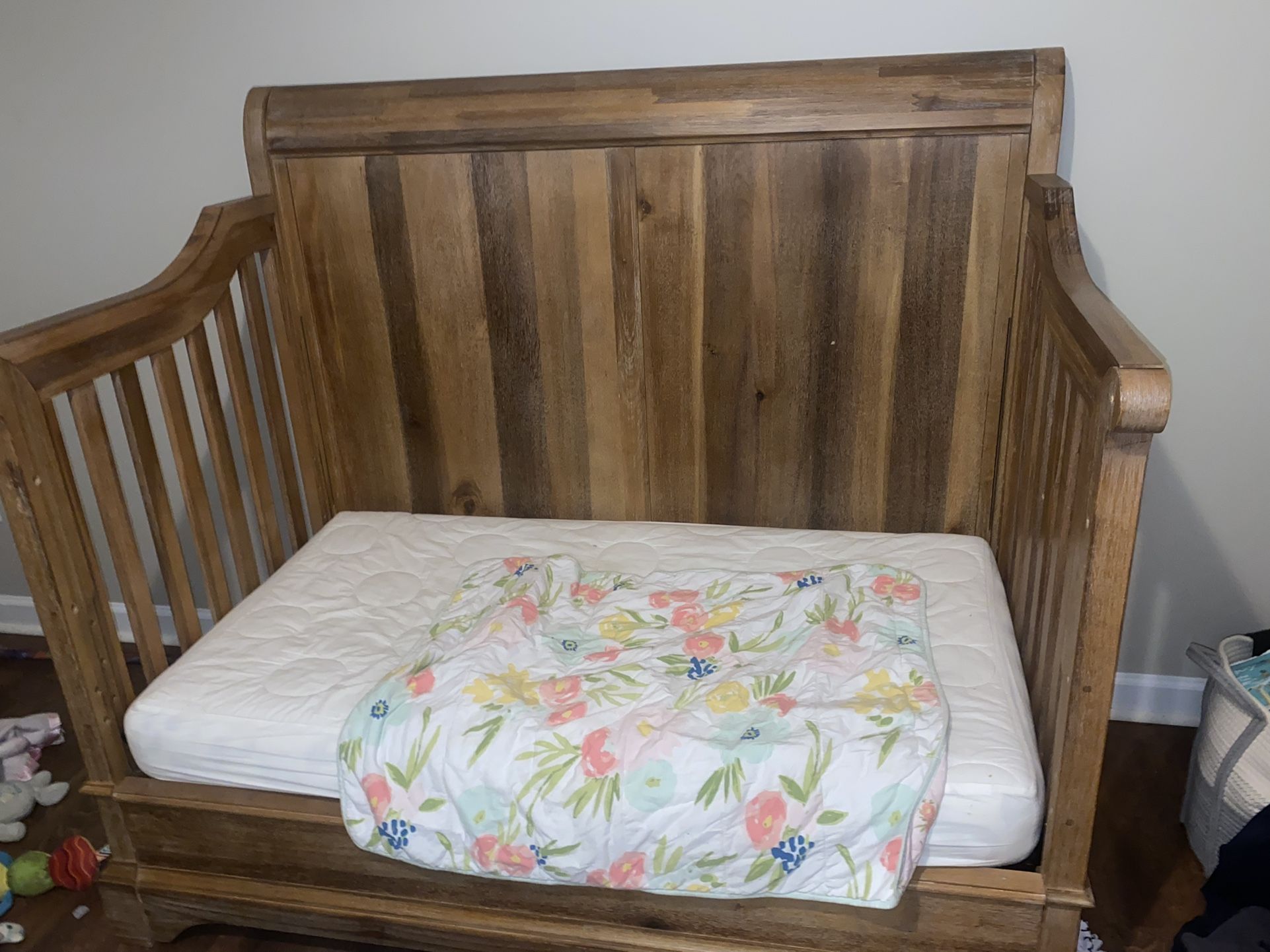 The is a toddler bed but we also have the rail that makes it a crib. Comes with mattress & mattress cover as well as the dresser. No marks!  