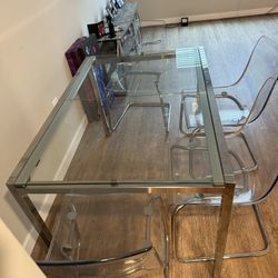 Glass Table And Clear Chairs  