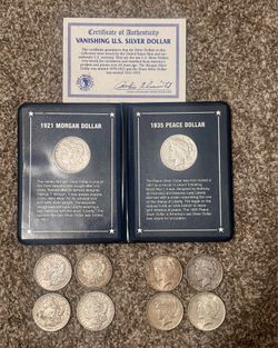 Morgan & Peace silver dollars.