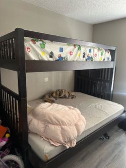 Used bunk bed w/ trundle and storage space