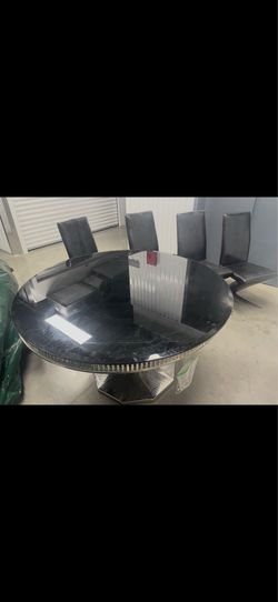Black glass and silver round table with 4 chairs