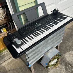 Yamaha E273 Keyboard - excellent w p/s, music stand and sustain pedal.  Everything works as it should.  Lots of voices and sounds.  Demo songs etc.   