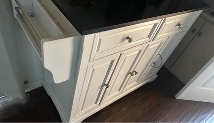 White Kitchen Island with Black marble Countertop
