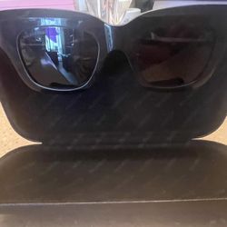 The Balenciaga sunglasses in the image are the BB0234S model. Black Cat Eye frame. 