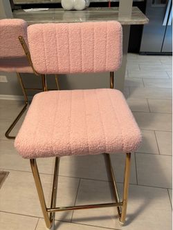 2 pink bar stools