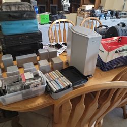 Sony speakers with subwoofer and samsung speakers. and tapes and a Sony receiver and technics cassette player.