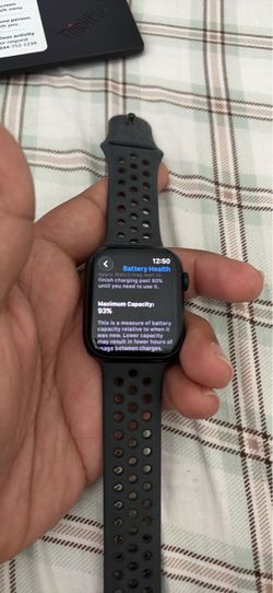 Apple Watch Series 7 (GPS + Cellular) with a black Nike Sport Band.