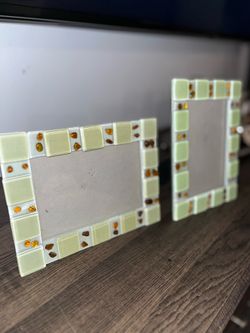 Set of two AI Overview These are green and amber glass picture frames