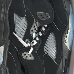 Black Metallic Jordan 5s in size 12.5 for men. 