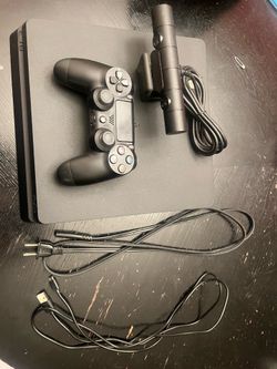 PS4 Slim 500GB + Original Controller + PS4 Camera – Good Condition