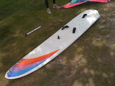 Rocket 99 winsurfing board with sail ready to ride