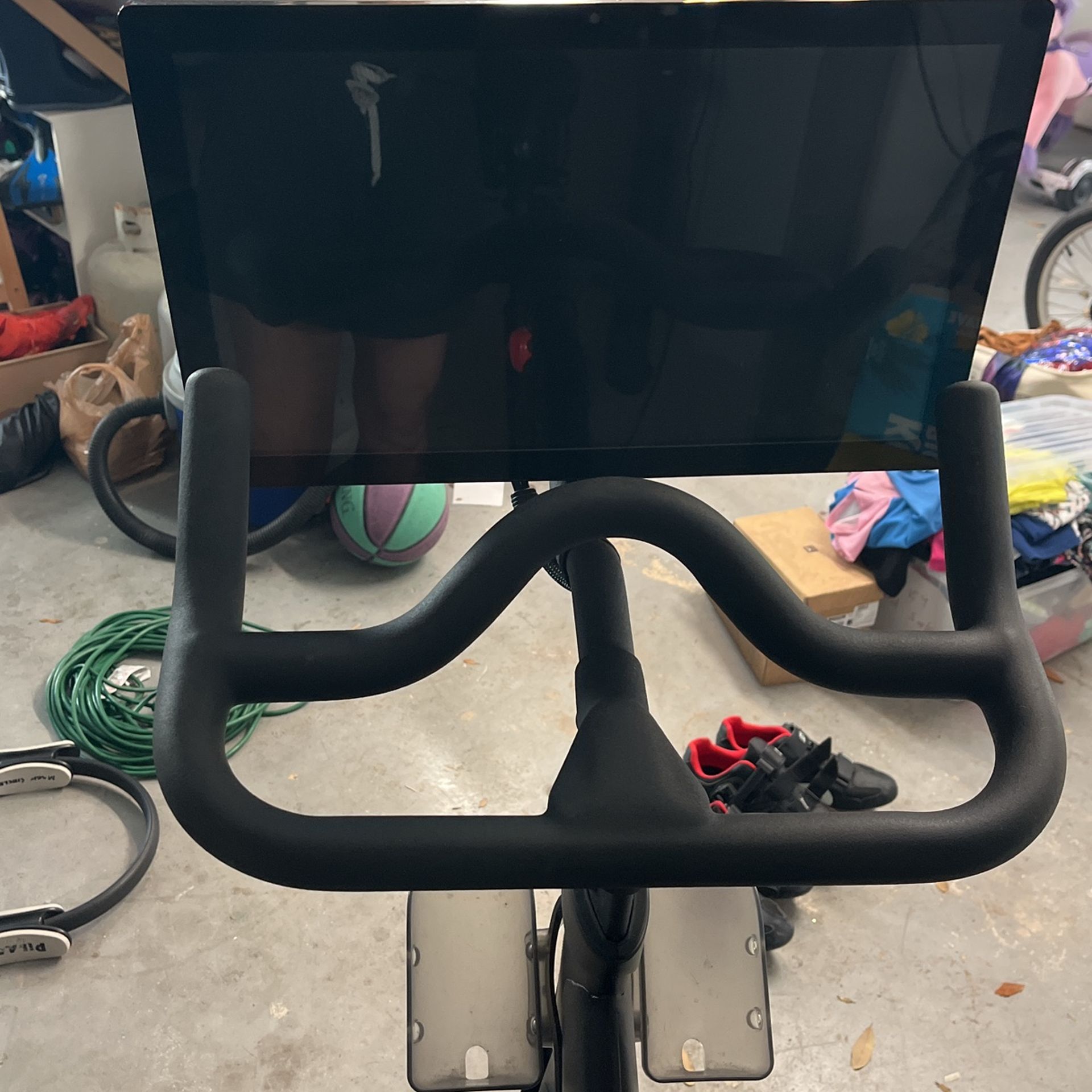 Peleton Bike With Two Pairs Of Shoes