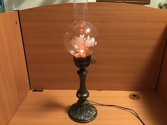 Vintage very old lamp with flame bulb and pretty glass shade