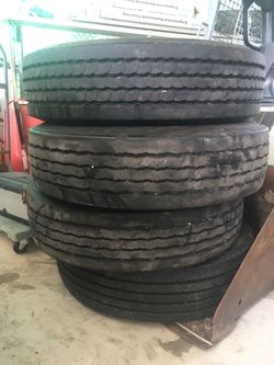 4 Truck Tires. 255 70R 22.5 with 85% rubber.