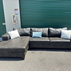 Nice Grey Leather Sectional Couch By Ashley Furniture ( Throw Pillows Not Included )