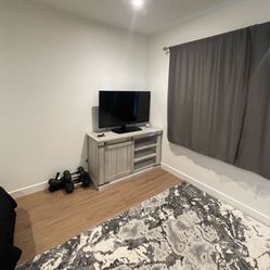 TV Stand- Ashley Home Furniture 