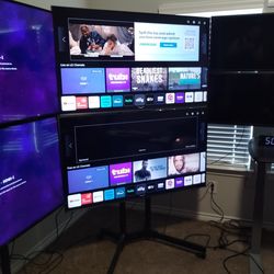 55-in TVs 2 of them with floor stand