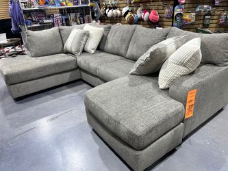 High quality reversible cushion sectional by Ashley