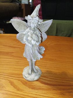 Outside fairy holding sunflower