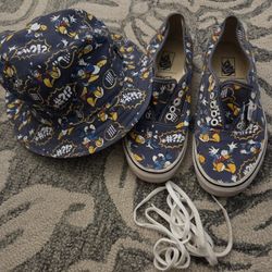 Disney-themed Vans shoes and a hat.