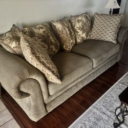 Like-new living room set with sofa, loveseat, accent chair, coffee table, and end table in excellent condition.