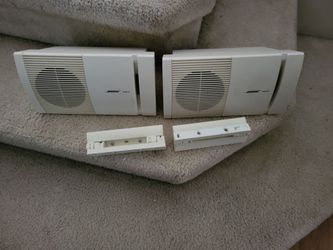 Bose model 100 patio/bookshelf speakers with mount brackets