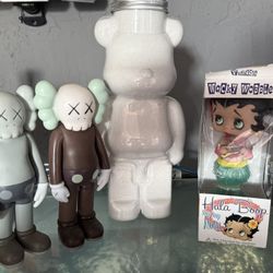 2 KAWS figure , BearBrick & Funko Wacky Wobbler featuring Betty Boop in a Hula Aloha outfit.
