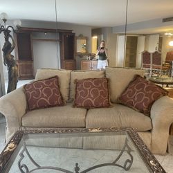 Beige couch. Barely used. 6 feet. Spotless.. Living room ready plus pillows