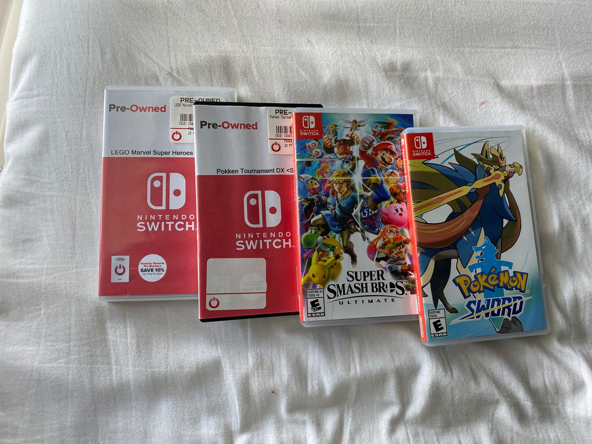 Nintendo Switch Game Bundle ( Pokemon Sword, Smash Bros, pokken Tournament, Lego Marvel Super heroes 2)