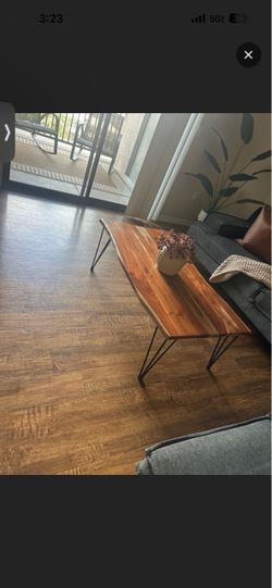 Wooden coffee table with black metal legs